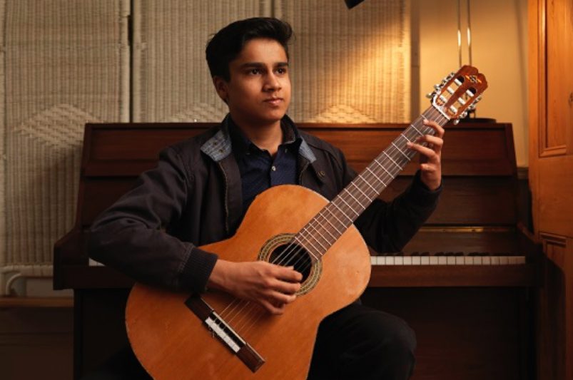 boy playing guitar